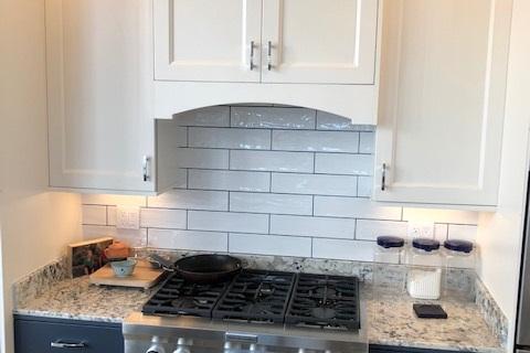 Curb Appeal Construction New Kitchen White Cabinets with Blue Lowers Subway Tile Back splash Eureka