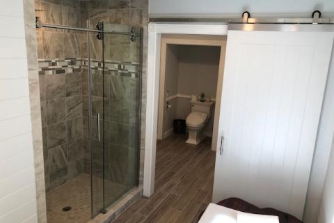 Walk in shower with soft close barn door 